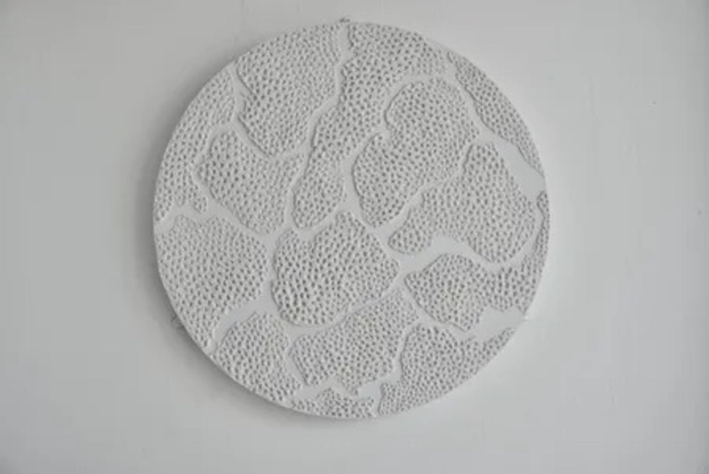 Spinning Wheel. Plaster On Top of Enamelled Background Displayed On a Lazy Susan.