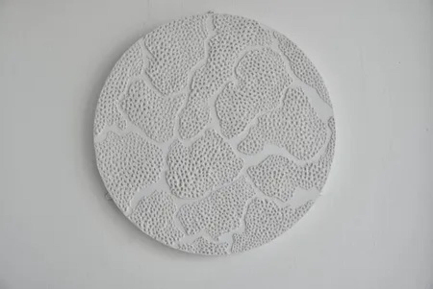 Spinning Wheel. Plaster On Top of Enamelled Background Displayed On a Lazy Susan.