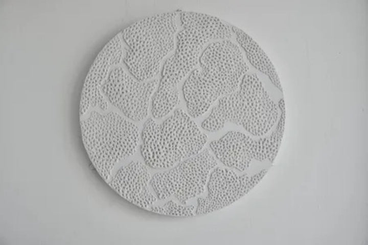 Spinning Wheel. Plaster On Top of Enamelled Background Displayed On a Lazy Susan.